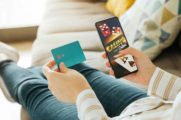 Mobile phone displaying result ncd card games interface with live table options